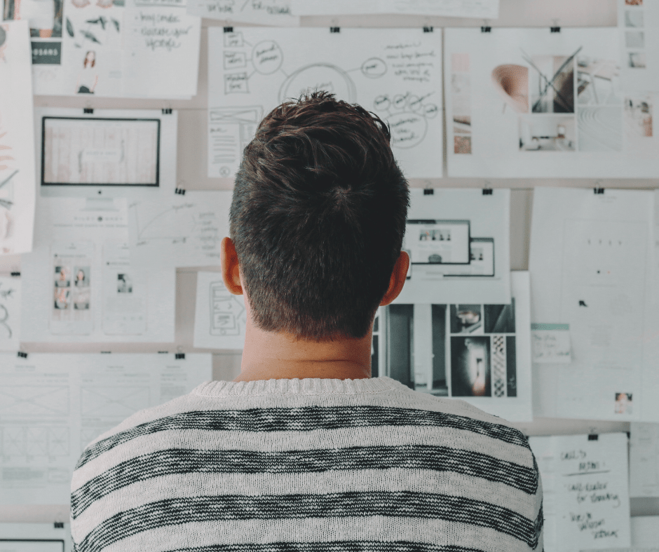 Man looking at wall of information